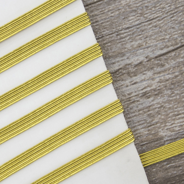 Резинка продежка 6,5 мм, цвет золотистый люрекс. Арт 851146008X7000          